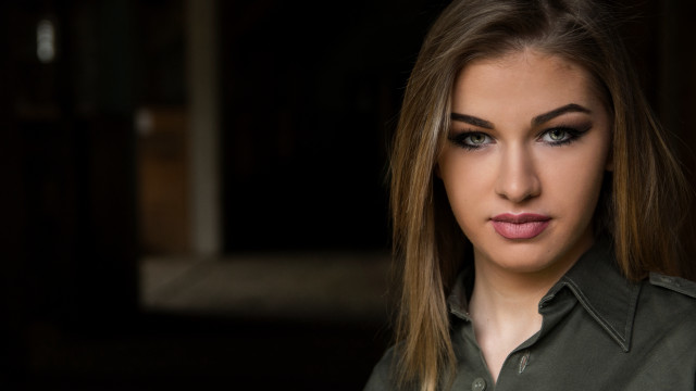 Woman green shirt pony tail free wallpaper for desktop - medium preview image