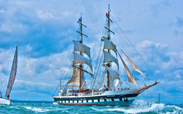 Large sailboat ocean cloudy day free wallpaper for desktop - medium preview image