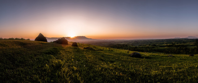 Grassy hill sunset rocks trees free wallpaper for desktop - medium preview image