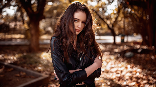 Woman leather jacket park portrait free wallpaper for desktop - medium preview image