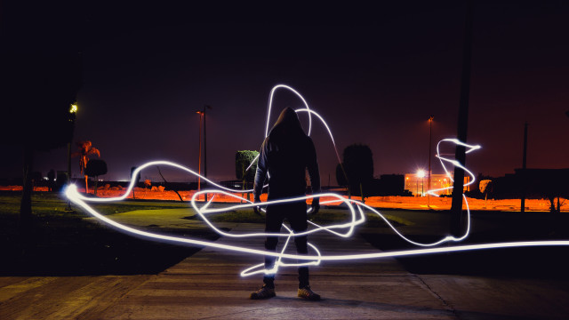 Person lightpainting cyberpunk night outdoors free wallpaper for desktop - medium preview image