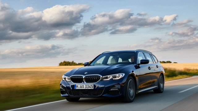 Blue bmw driving cloudy sky free wallpaper for desktop - medium preview image