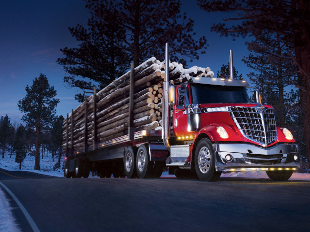 Red semi truck hauling logs free wallpaper for desktop - medium preview image