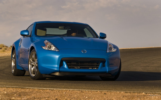 Blue sports car desert road free wallpaper for desktop - medium preview image
