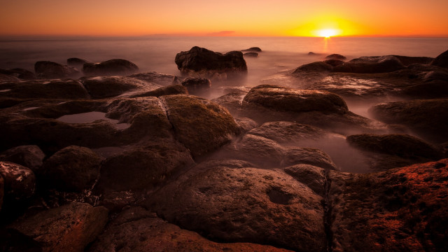 Sunset rocky beach orange sun free wallpaper for desktop - medium preview image