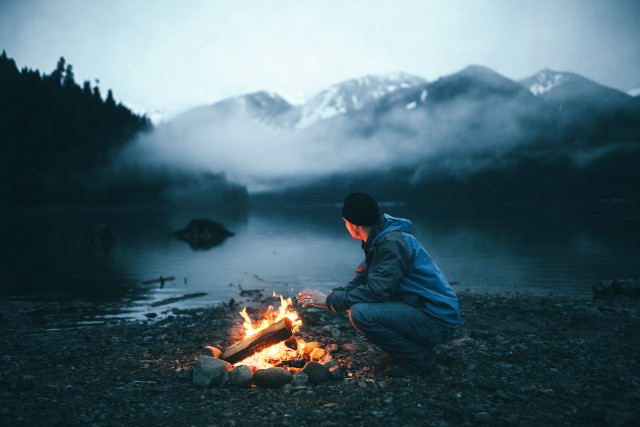 Fire sitting man lake mountains free wallpaper for desktop - medium preview image