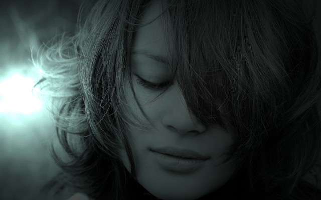 Woman blowing hair dark room free wallpaper for desktop - medium preview image