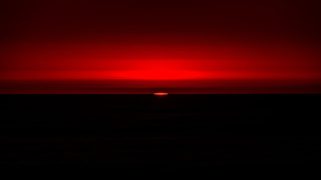 Red sky sunset ocean boat free wallpaper for desktop - medium preview image