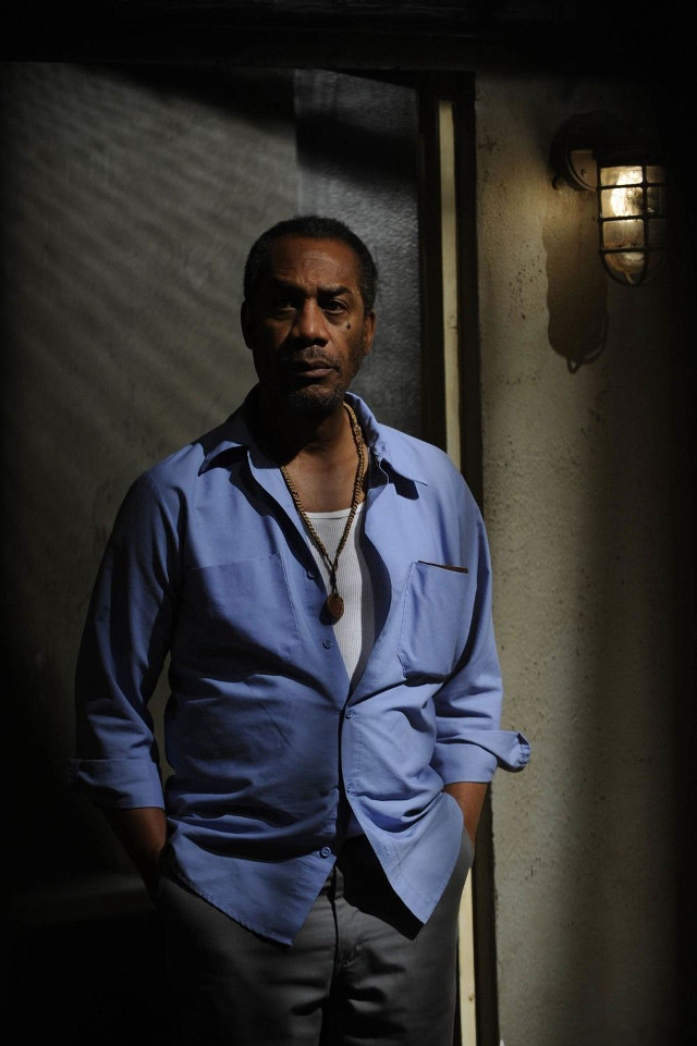 Man standing doorway hands pockets free wallpaper for mobile - medium preview image