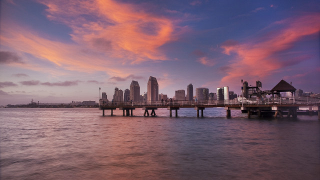 City skyline water sunset pier free wallpaper for desktop - medium preview image