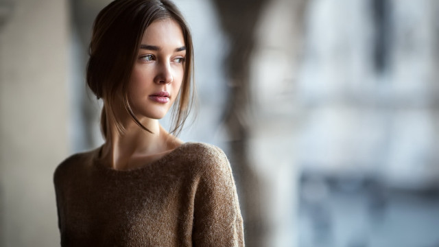 Woman brown sweater serious portrait free wallpaper for desktop - medium preview image