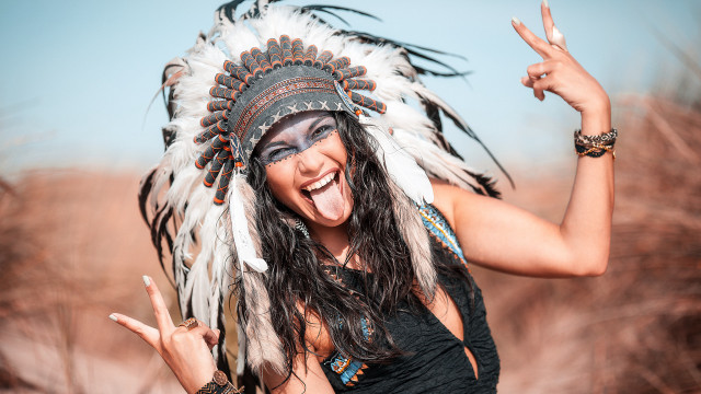 Woman feather headdress peace sign free wallpaper for desktop - medium preview image