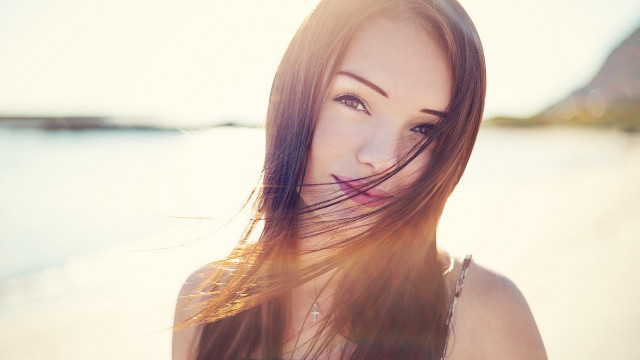 Woman beach long hair sunshine free wallpaper for desktop - medium preview image