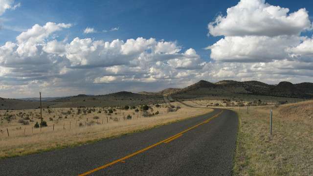 Road field mountains clouds sky free wallpaper for desktop - medium preview image