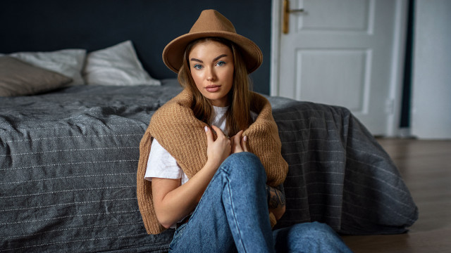 Woman sitting hat sweater blanket free wallpaper for desktop - medium preview image