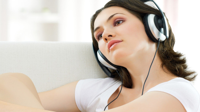 Woman headphones couch relaxing asian free wallpaper for desktop - medium preview image