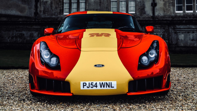 Red yellow sportscar building sign free wallpaper for desktop - medium preview image