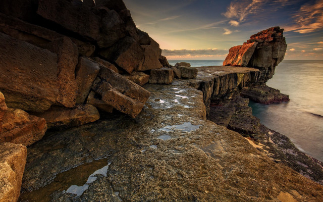 Rocky cliff water bench cloudscape free wallpaper for desktop - medium preview image
