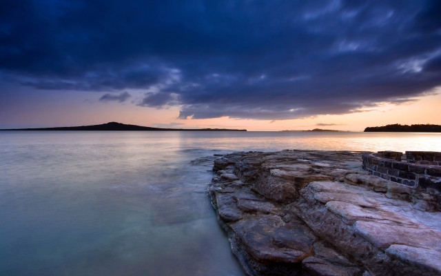 Rocky shore dusk island ocean free wallpaper for desktop - medium preview image