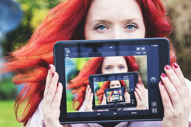 Red hair woman tablet camera free wallpaper for desktop - medium preview image