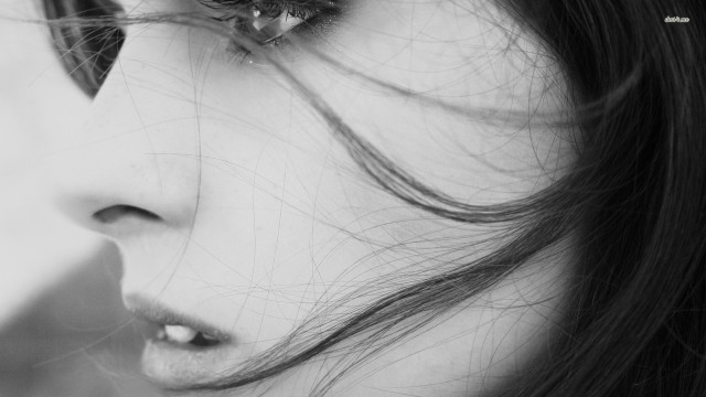 Serious woman long hair flower free wallpaper for desktop - medium preview image