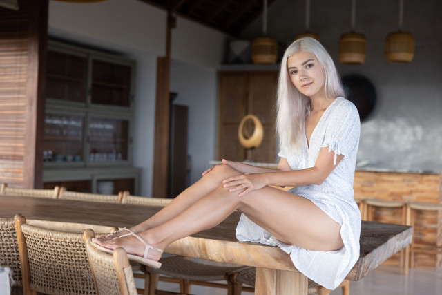 White haired woman library sitting free wallpaper for desktop - medium preview image