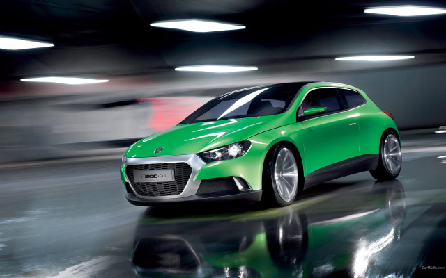 Green car driving street building free wallpaper for desktop - medium preview image