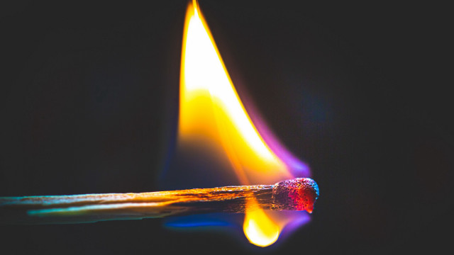 Matchstick yellow flame black background free wallpaper for desktop - medium preview image