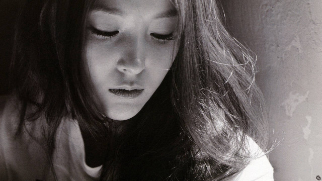 Woman long hair looking down free wallpaper for desktop - medium preview image