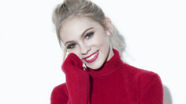 Woman smiling ponytail red sweater free wallpaper for desktop - medium preview image