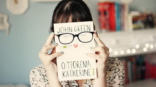 Woman holding book glasses nails free wallpaper for desktop - medium preview image