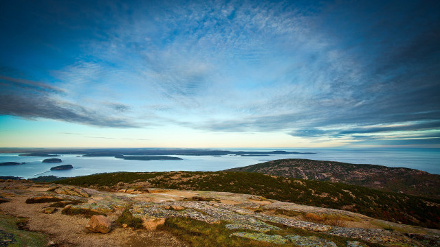Hill overlooking water mountains cloudy free wallpaper for desktop - medium preview image