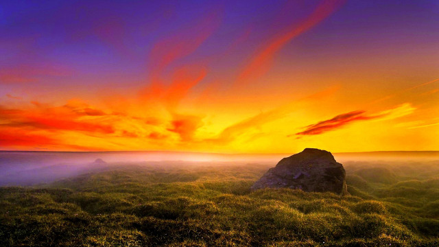 Sunset grassy field rock red free wallpaper for desktop - medium preview image