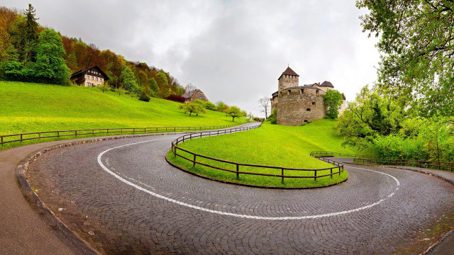 Winding road stone building fence free wallpaper for desktop - medium preview image