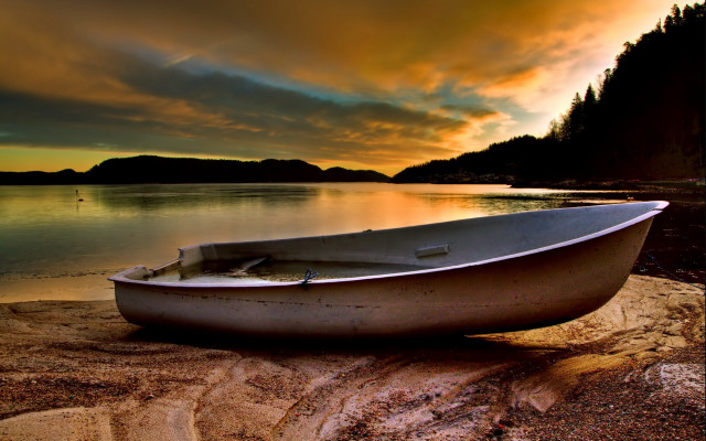 Boat shore lake sunset dramatic free wallpaper for desktop - medium preview image