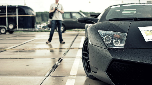 Man walking black sports car free wallpaper for desktop - medium preview image