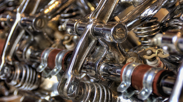 Metal assemblage wheels springs blurry free wallpaper for desktop - medium preview image