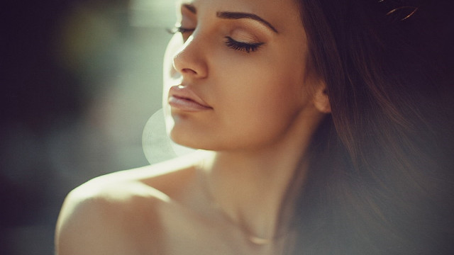 Woman longhair necklace looking down free wallpaper for desktop - medium preview image