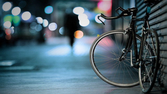 Bicycle parked wall sidewalk night free wallpaper for desktop - medium preview image