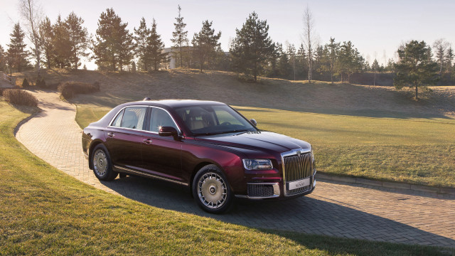 Red car grassy hill digital free wallpaper for desktop - medium preview image