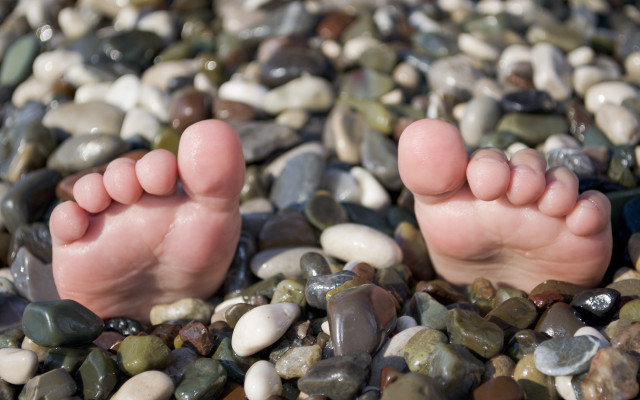 Barefoot rocks pebbles beach foreshortening #2 free wallpaper for desktop - medium preview image