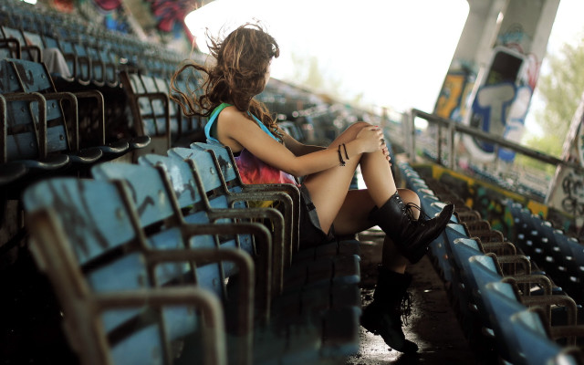 Woman stadium bench crossed legs free wallpaper for desktop - medium preview image