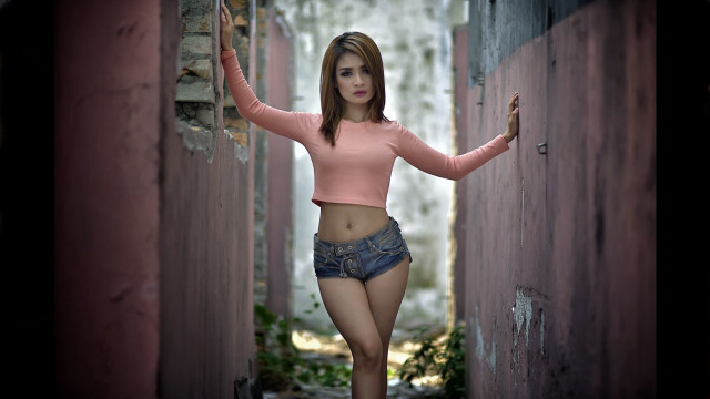 Woman pink shirt shorts alleyoutstretched free wallpaper for desktop - medium preview image