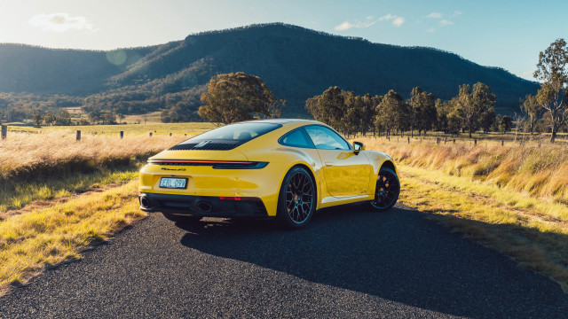 Yellow sports car mountain road free wallpaper for desktop - medium preview image