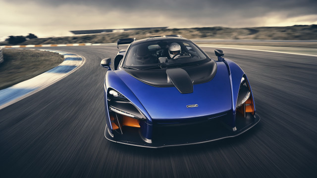 Blue sports car driving cloudy free wallpaper for desktop - medium preview image