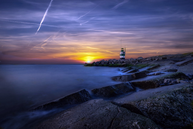 Lighthouse rocky shore sunset contrails free wallpaper for desktop - medium preview image
