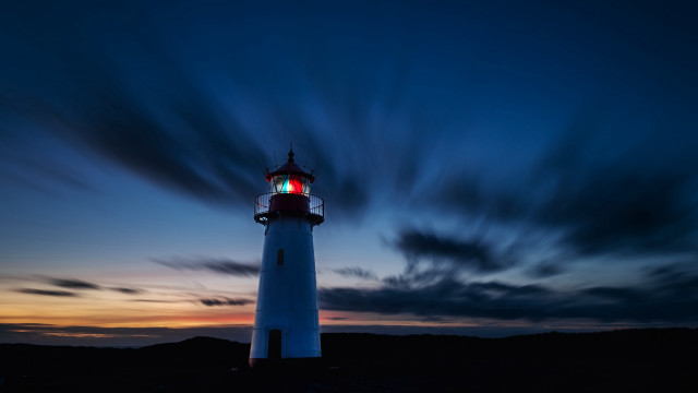 Lighthouse red light night clouds free wallpaper for desktop - medium preview image