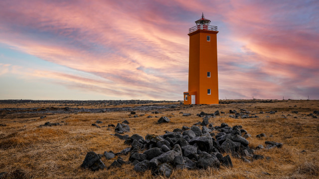 Red lighthouse dry grass rocks free wallpaper for desktop - medium preview image