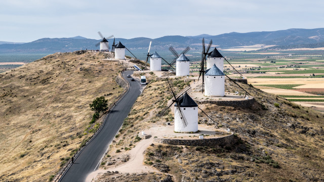 Road windmills hills mountains sunset free wallpaper for desktop - medium preview image