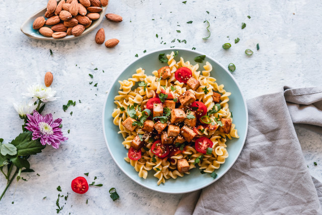 Pasta nuts cherry tomatoes table free wallpaper for desktop - medium preview image